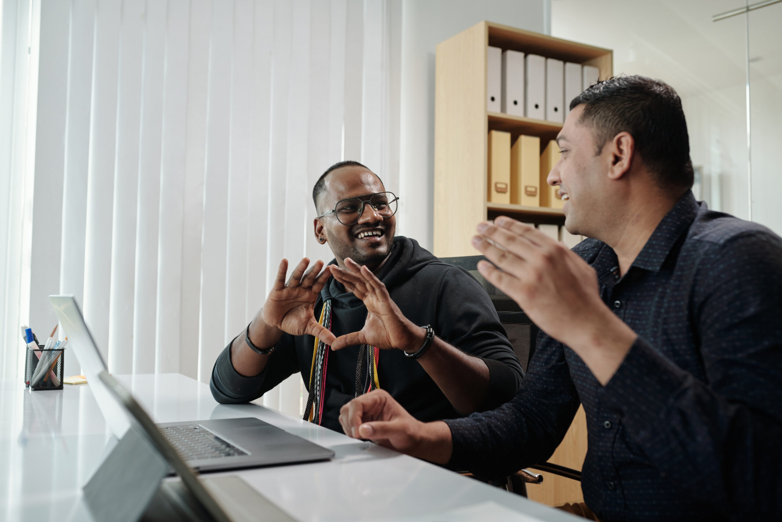 Business colleagues discussing product features