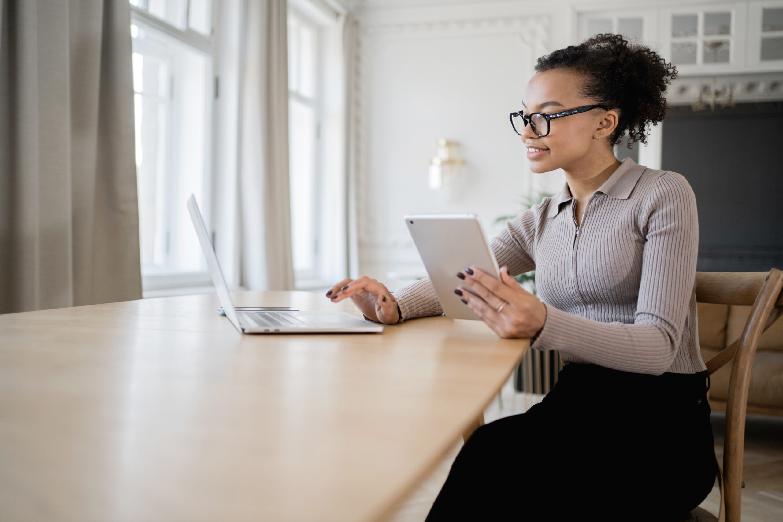 Freelancer woman work modern office uses laptop computer