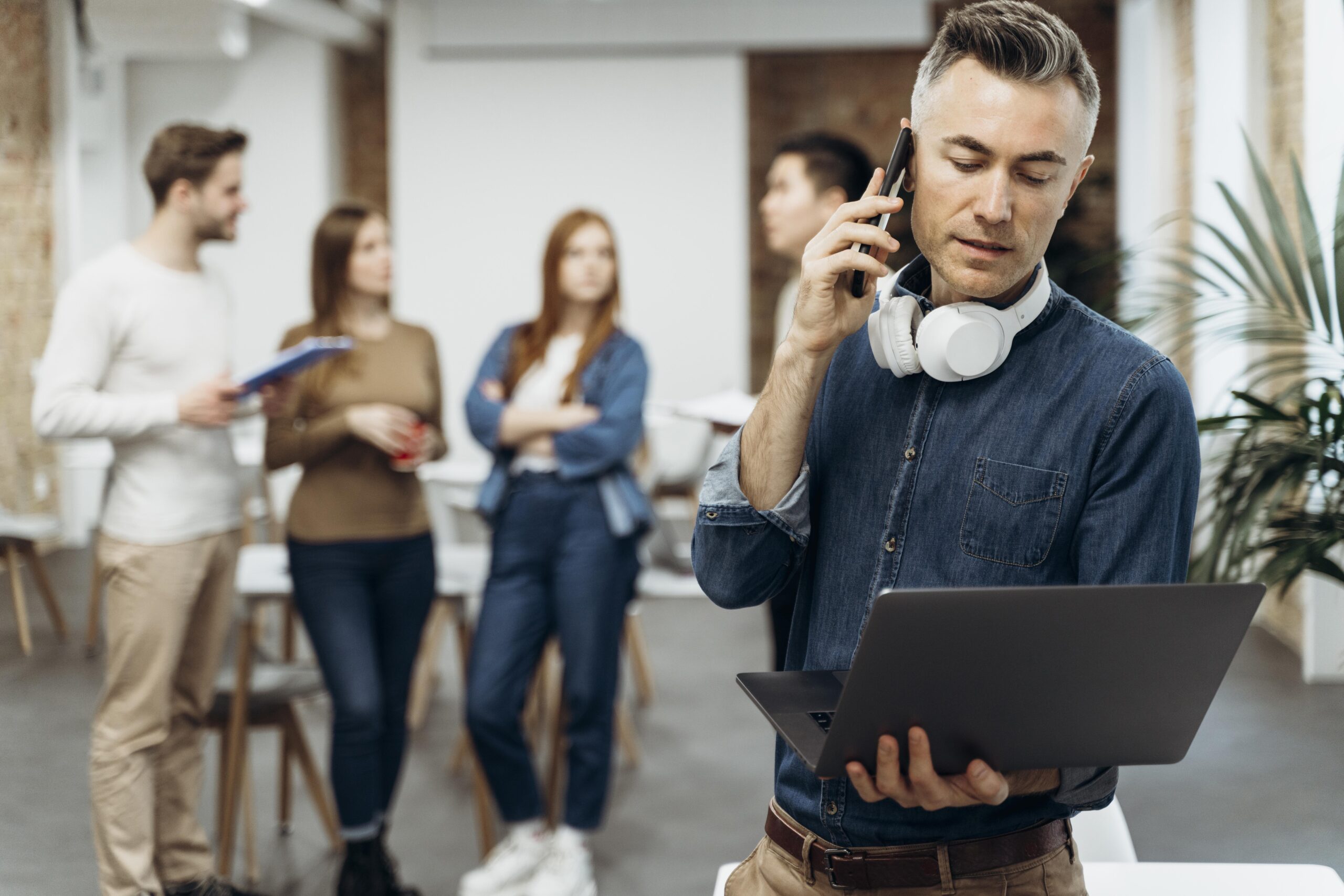 Professional using VoIP tools in a modern office environment to ensure high call quality and team communication