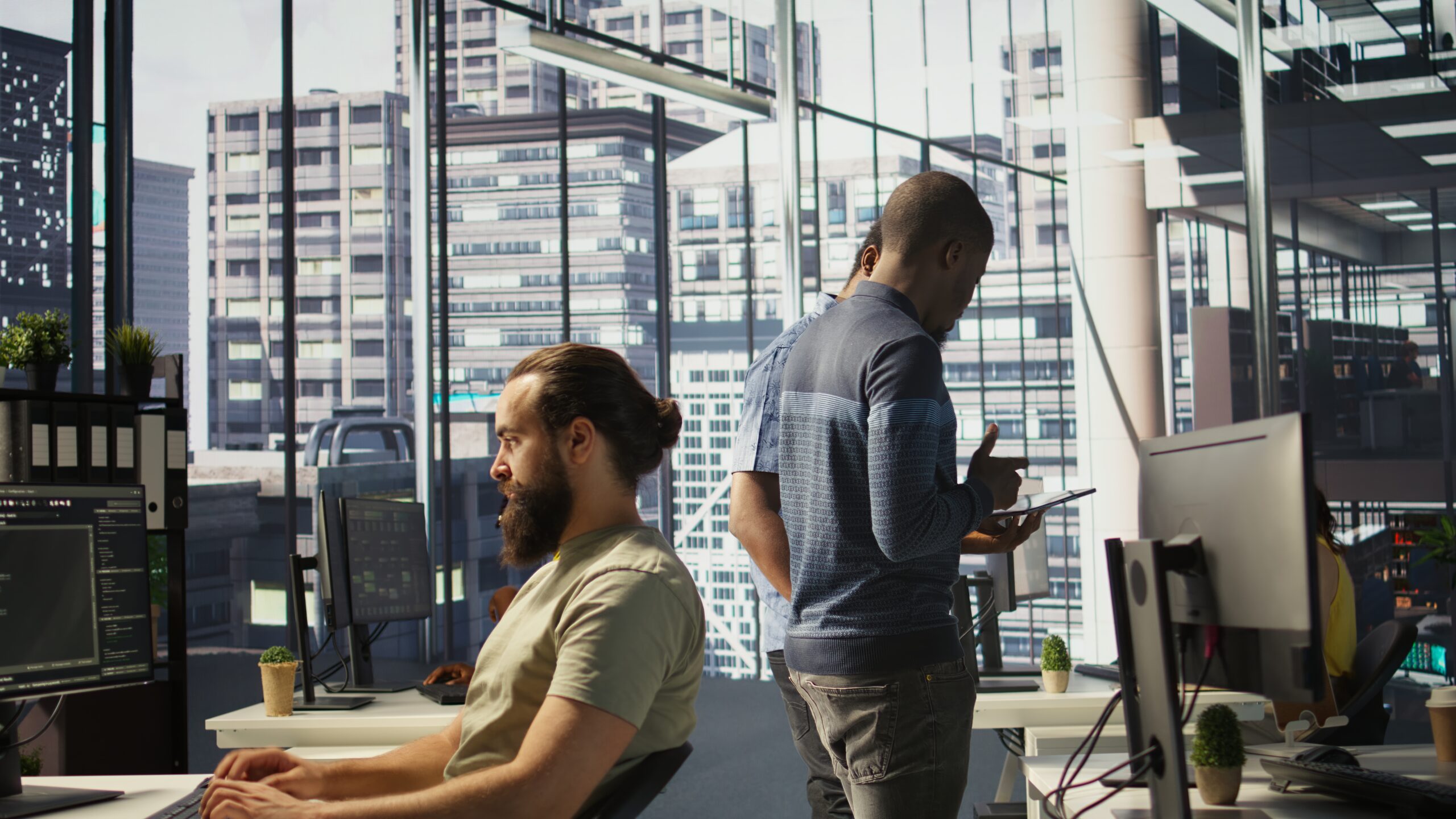Modern office with professionals using digital tools for cloud communication.